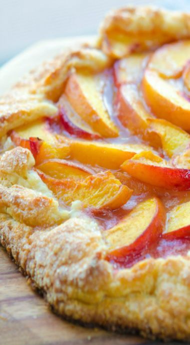 there is a pie with peaches on it