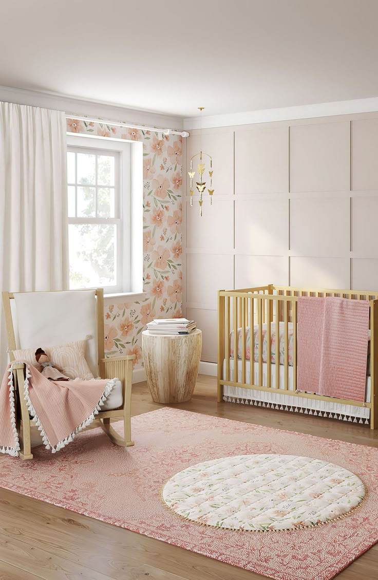 a baby's room with pink and white decor