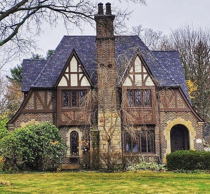 a large brick house with two story windows