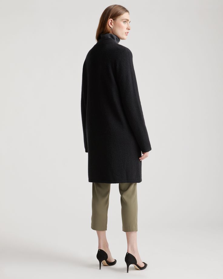 Part sweater, part coat, 100% cozy. This is the piece you’ll turn to every time there’s a chill in the air. Designed with a relaxed fit, our Superfine Merino Wool Sweater Coat is easy to layer over jeans or with one of our tencel dresses for a casual, laidback look. It’s so soft and comfy you might never take it off.  | Quince | Women's Superfine Merino Wool Sweater Coat in Black, Size XS Fall Outerwear With Funnel Neck, Cozy Fit Funnel Neck Outerwear For Fall, Oversized Cashmere Outerwear For Winter, Winter Relaxed Fit Sweater Coat For Cold Weather, Everyday Winter Turtleneck Outerwear, Oversized Outerwear With Ribbed Collar And Funnel Neck, Cozy Fit Turtleneck Outerwear For Fall, Chic Cashmere Outerwear With Ribbed Cuffs, Cozy Outerwear With Ribbed Cuffs And Funnel Neck