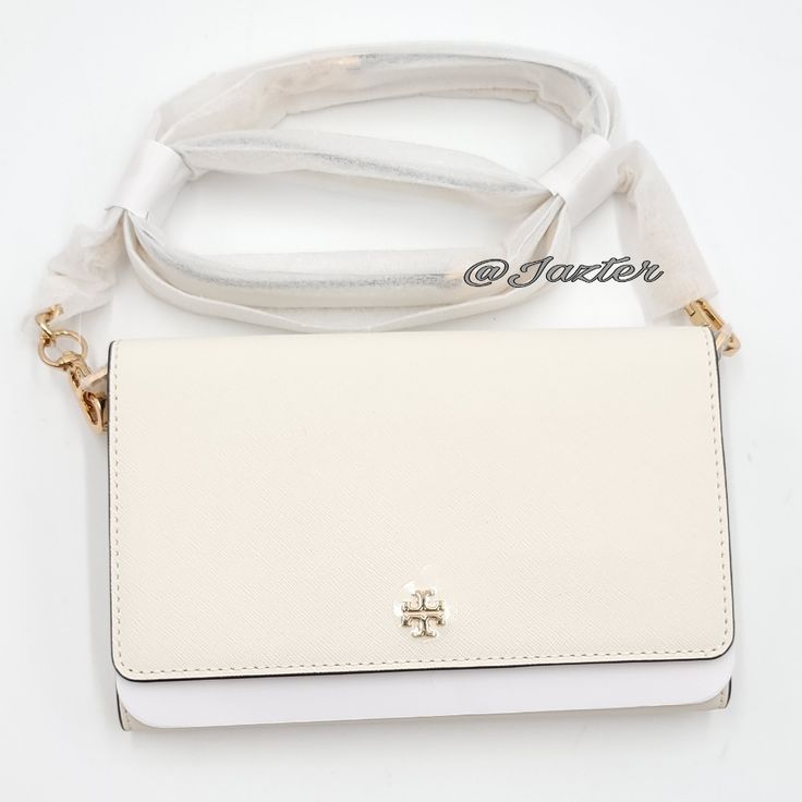 Detachable Crossbody Strap Magnetic Snap Closure Interior: Slip Pockets, Zip Pocket, Card Slots Exterior: Back Slip Pocket White Chic Wallet On Chain For Formal Occasions, Classic White Wallet On Chain For Formal Occasions, Chic White Wallet On Chain For Formal Occasions, Elegant White Wallet On Chain For Formal Occasions, Chic White Wallet On Chain For Everyday, Classic White Leather Wallet On Chain, White Leather Classic Wallet On Chain, Elegant White Crossbody Wallet On Chain, White Rectangular Wallet On Chain For Evening