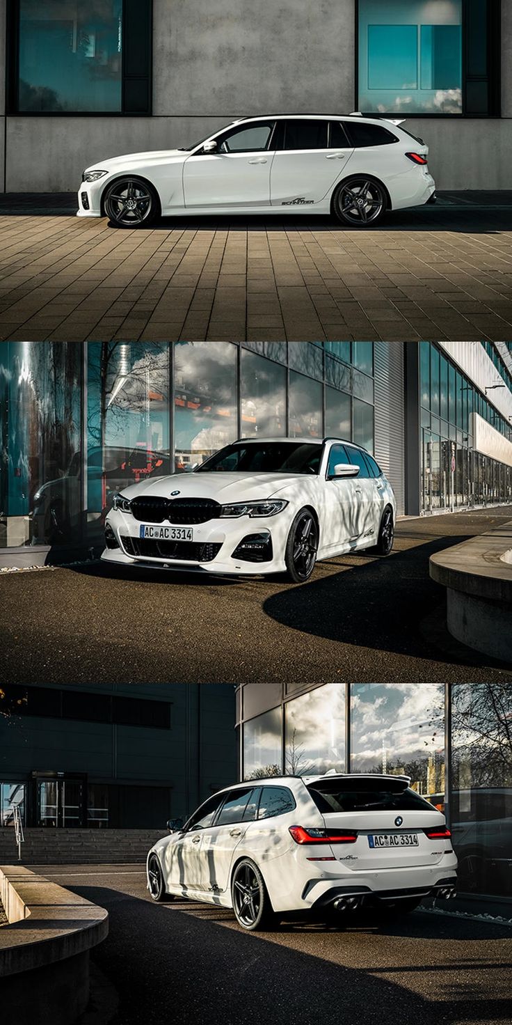 two white cars parked next to each other in front of a building with glass windows