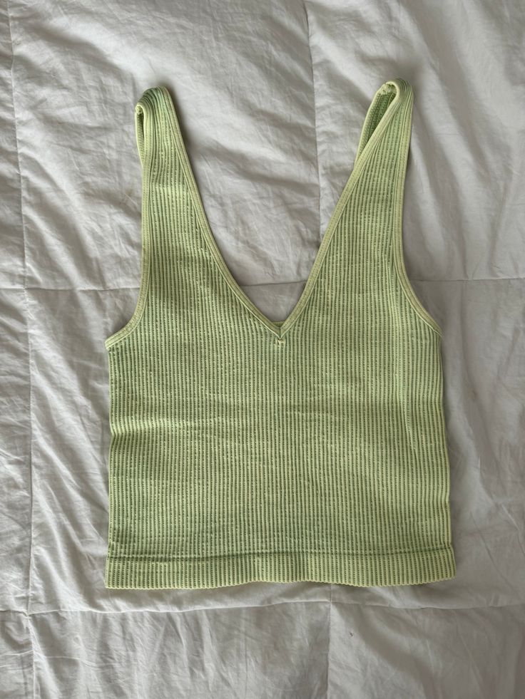 these tanks are made with super-elastic materials for maximum comfort & durability! they are one size fits most <3 they can be worn with the v neck in the front or the back depending on the look you’re going for! worn with the “do it” zip up! Seamless Green Tank Top For Spring, Green Vest Tops For Vacation, Trendy Cotton V-neck Top For Summer, Trendy V-neck Vest For Summer, Seamless V-neck Crop Top For Vacation, Basic Green Tank Top For Summer, Basic Green Tank Top For Spring, Trendy Green Crop Top For Everyday, Casual Seamless Summer Vest