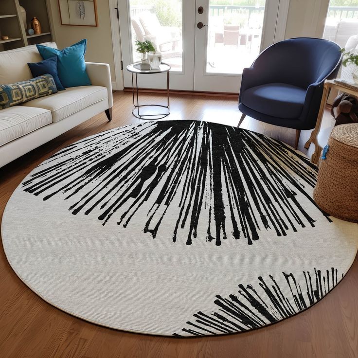 a living room with a white rug and blue chairs