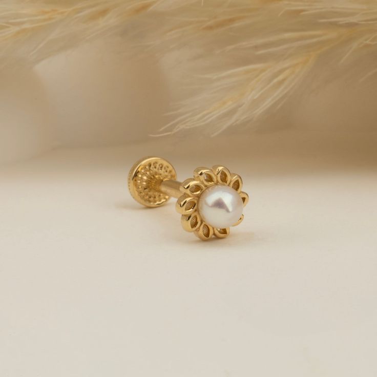 Flower Motif Pearl Tragus Piercing, Cartilage Earring, 14K Solid Gold Tragus Piercing, Minimalis Tragus Piercing, Gold Stud Piercing Dianora - Gold Piercing in Every Style Step into a realm where elegance meets adornment at Dianora Gold Piercing. Discover the transformative experience of adorning yourself with our exquisite gold piercings. Each piece tells a story of timeless beauty and individuality, elevating your style to handcrafted jewelries. Let us guide you on a journey of self-expression and radiance. Product Details: Material: 14K Solid Gold Gram: 0,42 gram Bar Thickness: 1.2 mm (16G) Lock System: Screw Lock System Color Options: Gold, Rose Gold, White Gold Why Dianora Piercing? Handmade Excellence: Every piece is carefully handcrafted with love and experience. Customizable: Perso Internally Threaded 14k Gold Wedding Earrings, Elegant Internally Threaded Yellow Gold Jewelry, 14k Gold Internally Threaded Earrings For Wedding, Adjustable Gold Cartilage Earrings For Wedding, Classic Yellow Gold Cartilage Earrings For Wedding, Pierced 14k Gold Cartilage Earrings For Wedding, 14k Gold Pierced Cartilage Earrings For Wedding, Dainty 14k Gold Cartilage Earrings For Wedding, Dainty 14k Gold Wedding Cartilage Earrings