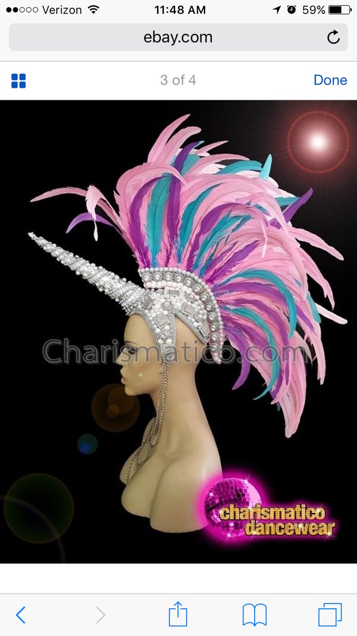 a pink and blue headdress on top of a mannequin's head