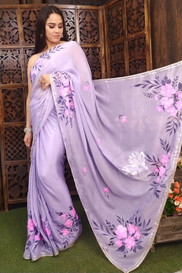 Hnad painted lavender silk chiffon saree with brigh fuchsia colour flowers allover and pair of love birds on the pallu, enhanced with sequin, beads and gota edging. Floral Blouse Designs, Fabric Colour Painting, Saree Painting Designs, Saree Painting, Hand Painted Dress, Fabric Painting On Clothes, Hand Embroidery Dress, Frock Fashion, Fabric Paint Designs