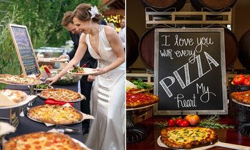 a woman standing in front of a table filled with pizzas and other food items