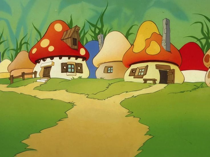 a group of mushroom houses sitting on top of a lush green field