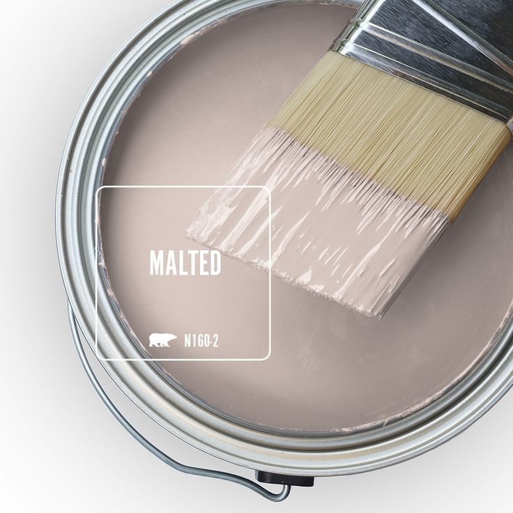 a paint can with a brush in it and the word malted on top of it