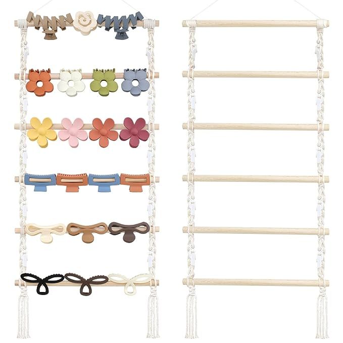 an assortment of hair clips and ties hanging from a rack on a white wall with beads