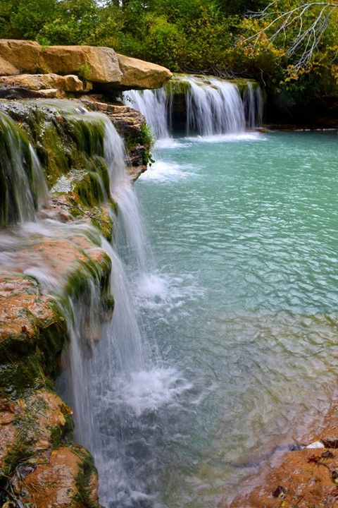 there is a small waterfall in the water