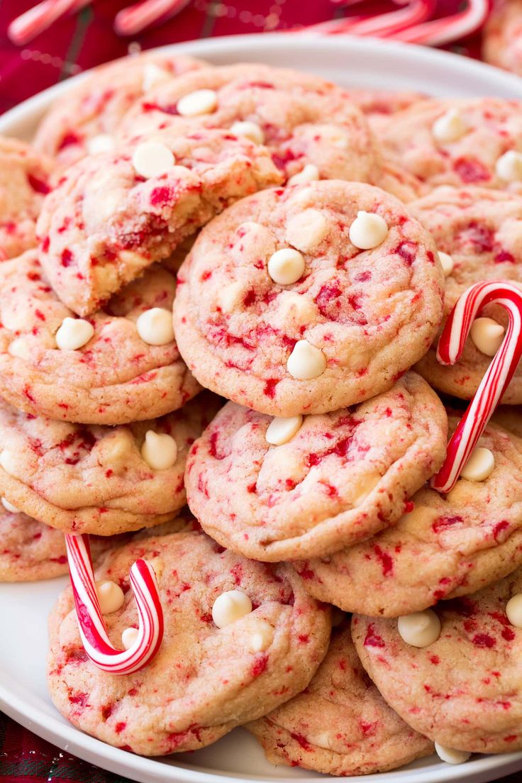 cookies with white chocolate chips and candy canes on a plate