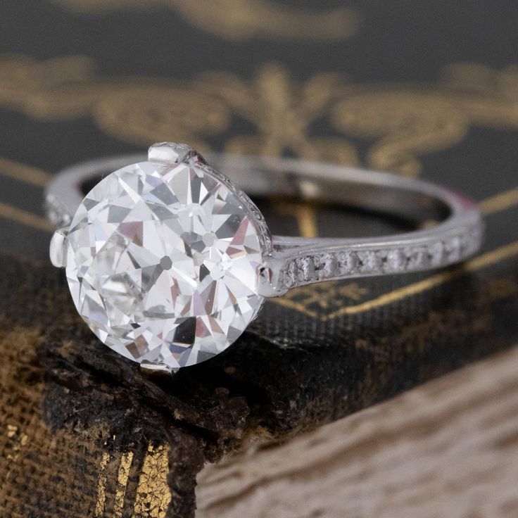 As beautiful and timeless as they get! A stunning, crisp and white old European cut diamond is set in this sleek and simple concoction, allowing the diamond to shine in its full old cut glory. Check out that much-desired flower facet pattern and sharp contrast zones.A beautiful ring that would be a truly special engagement ring. Platinum Size 6.75 & fully resizable Diamond measures 9.25 - 9.32 x 5.62 mmGIA link herehttps://www.gia.edu/report-check?reportno=6224122563*Diamond is also available lo Timeless Classic Cut Diamond Ring With Single Cut Diamonds, Timeless Diamond Ring With Single Cut, Timeless Diamond Ring With Single Cut Diamonds, Classic White Jewelry With Single Cut Diamonds, Classic Round White Topaz Diamond Ring, Classic Style Ring With Single Cut Diamonds, Classic Rings With Single Cut Diamonds And White Topaz, Classic Jewelry With Single Diamond In Round Band, Classic White Topaz Diamond Ring