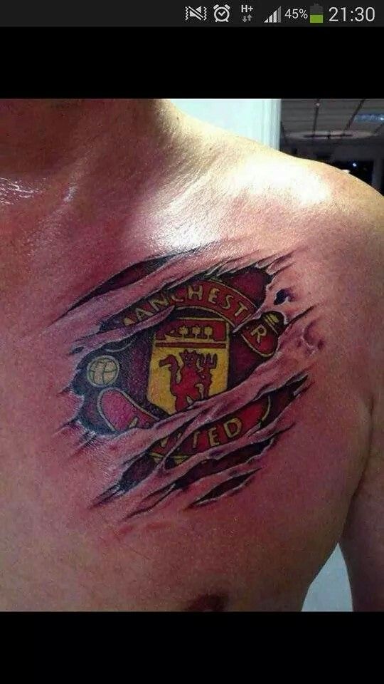 a man with a tattoo on his chest that has the manchester united crest ripped off