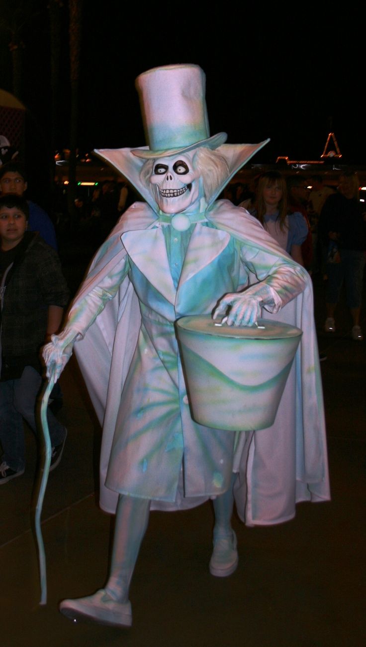 a man dressed as a skeleton holding a bucket