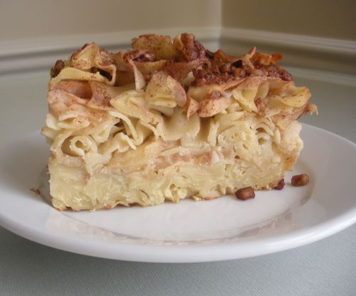 a white plate topped with a piece of cake