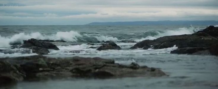 waves crashing on rocks in the ocean