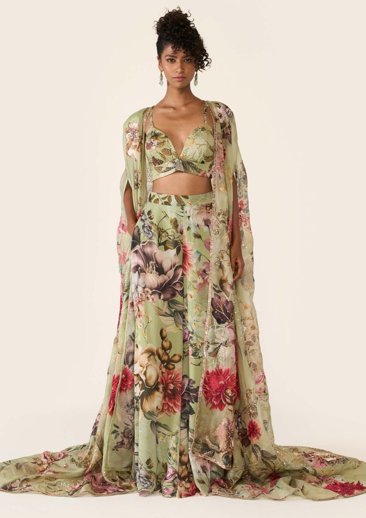 The green printed organza cape features sequin, cutdana and bead highlights with hand threadwork. It is paired with green printed bralette and trousers with thread work. Sari Designs, Organza Cape, Printed Organza, Sari Design, Palazzo Set, Vacation Style, Thread Work, Green Print, Photographic Lighting