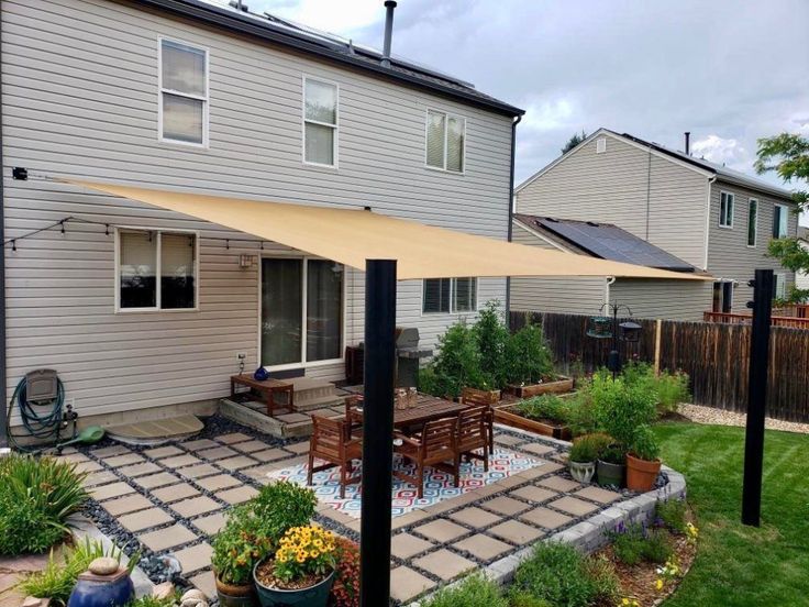 an outdoor patio with a table and chairs