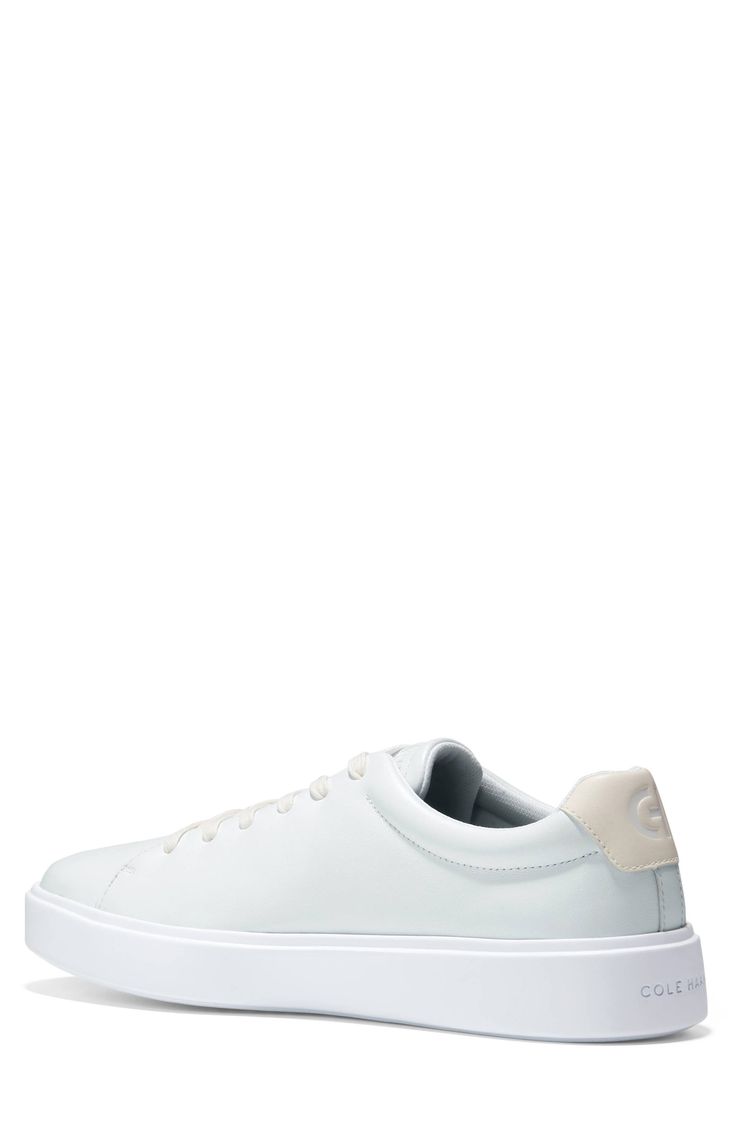 Smooth leather crafts a classic sport inspired low profile sneaker that features a luxuriously comfortable molded footbed that adds comfort to every step. Round toe Lace-up Cushioned insole Padded cuff White sole Leather upper, manmade sole Imported Modern Sneakers With Embossed Logo And Round Toe, Sporty Sneakers With Embossed Logo And White Sole, Modern Low-top Sneakers With Embossed Logo, White Synthetic Sneakers With Embossed Logo, Classic Synthetic Sneakers With Gum Sole, White Leather Skate Shoes With Embossed Logo, Modern Synthetic Skate Shoes With Gum Sole, Classic Synthetic Skate Shoes With Gum Sole, Classic Low-top Synthetic Skate Shoes