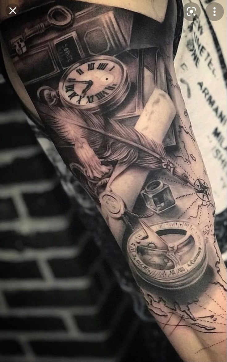 a man's arm with a clock, compass and other things on it in black and white