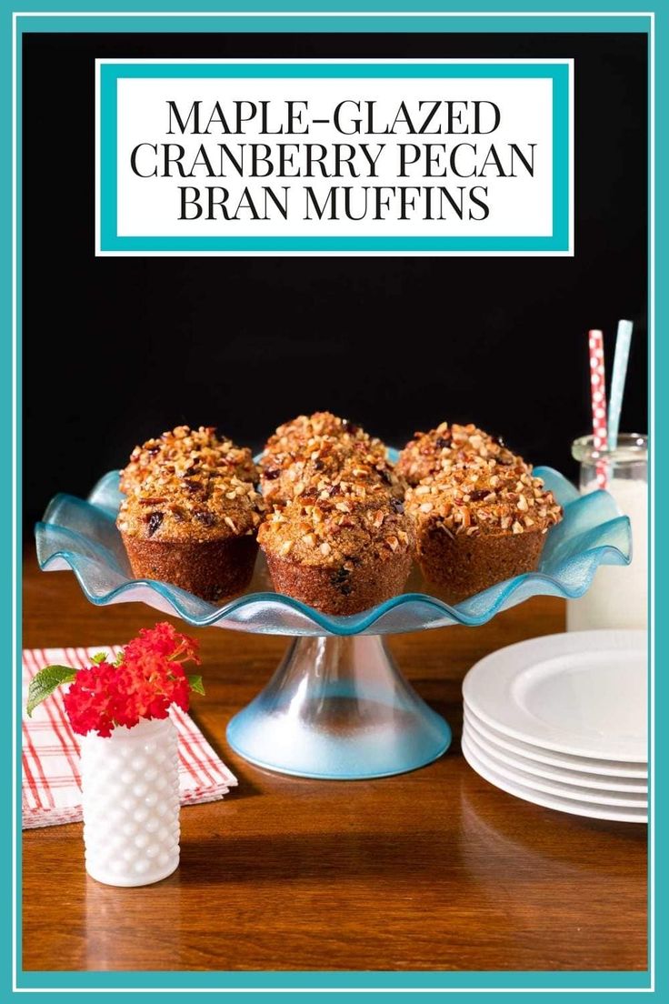 maple - glazed cranberry pecan bran muffins on a cake stand