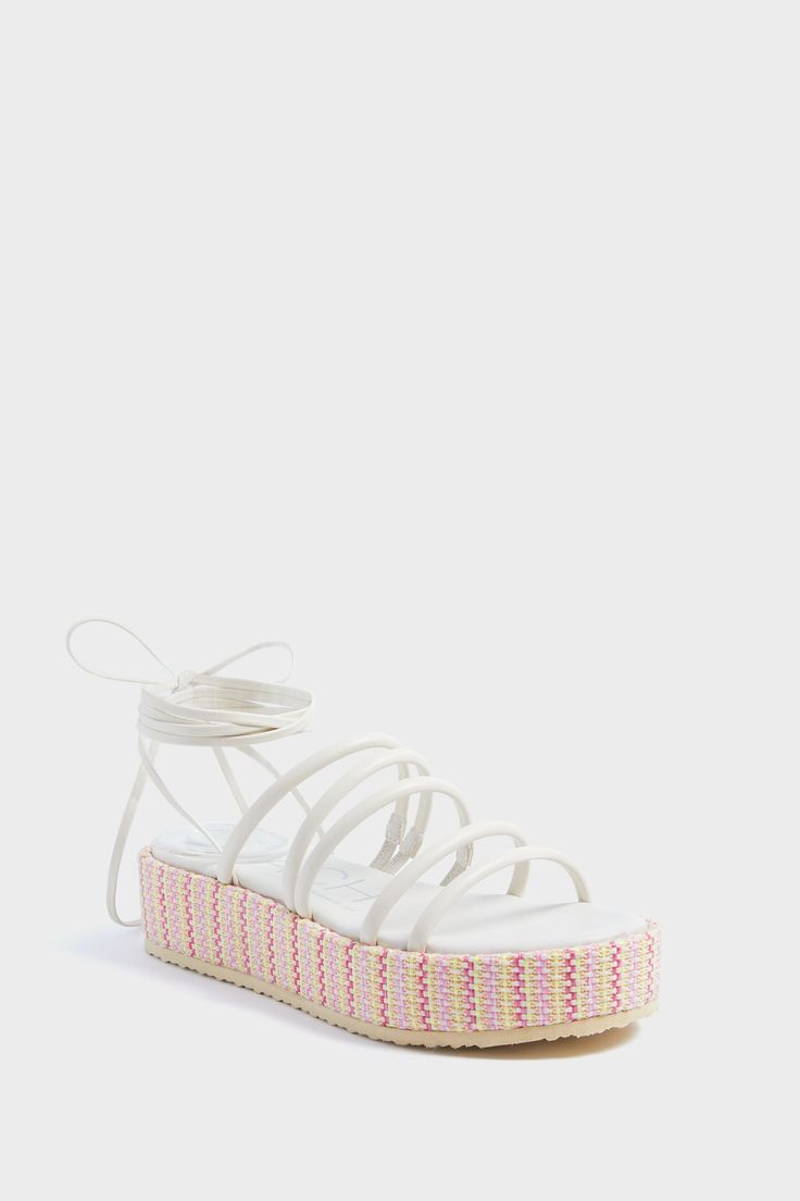 Ivory Lace Up Rainbow Platform Sandals White Platform Sandals For Vacation, Summer Flat Platform Lace-up Sandals, White Wedge Sandals For Summer Beach, Trendy White Wedge Sandals For Vacation, White Platform Sandals For Summer, Flat Platform Lace-up Sandals For The Beach, White Synthetic Sandals For Summer, White Synthetic Sandals For Beach Season, Summer Synthetic Strappy Lace-up Sandals