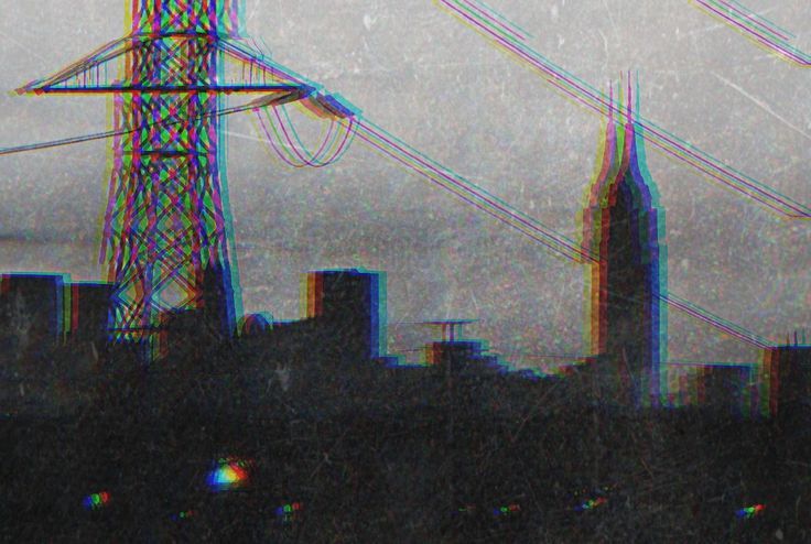 an image of power lines in the sky over a cityscape with tall buildings