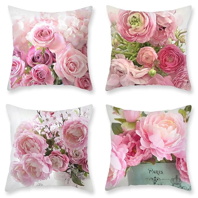 four pillows with pink flowers on them