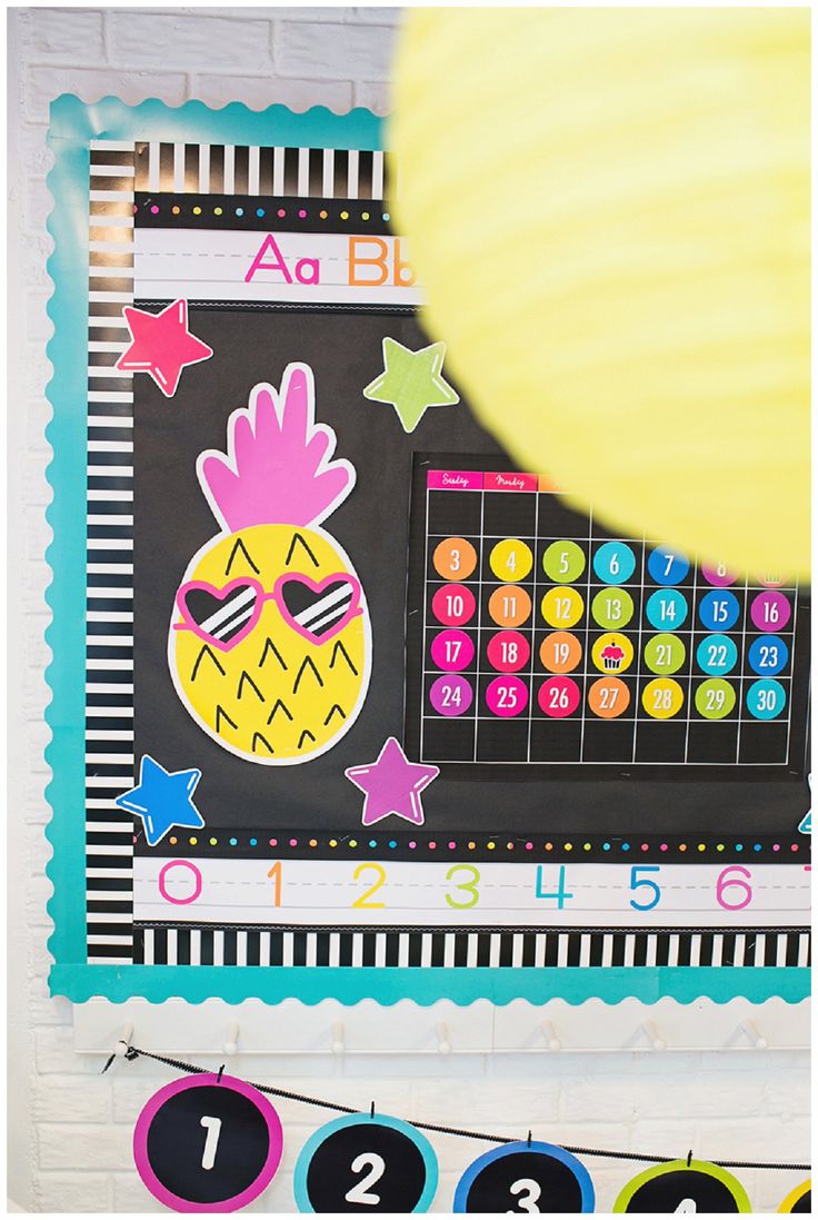 this is an image of a bulletin board with numbers and a pineapple on it