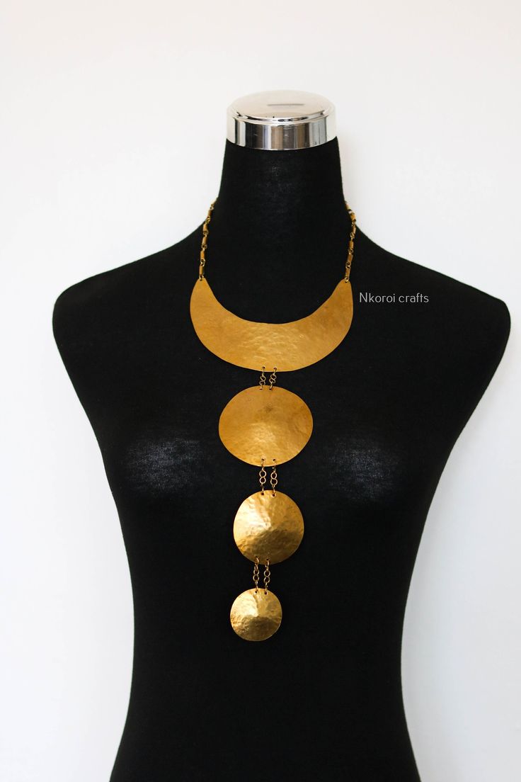 African Brass necklace, Brass jewelry, African jewelry for women, Tribal necklace, One size fits all, Christmas Gift for her, Moms gift The necklace is handcrafted using brass metal. Length: 14 inches Shipping fee is for the first item only, additional items ship for FREE. DHL Express shipping with 3-5 days delivery. To view our brass collection, click here: https://www.etsy.com/shop/NkoroiCrafts?ref=simple-shop-header-name&listing_id=1295061994&section_id=39639351 *Care instructions* Brass tarn Unique Necklaces For Celebration, Unique Celebration Necklaces, Metal Choker Gift, 16 Inch Length, Gift Metal Choker 16 Inch Length, Metal Choker 16 Inch Length As Gift, Round Brass Choker Gift, Gold Round Pendant Necklace With Unique Variations, Round Brass Necklaces For Celebration, Round Brass Choker For Gift