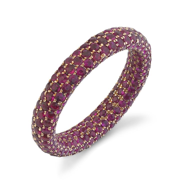 a purple and gold ring with diamonds on it