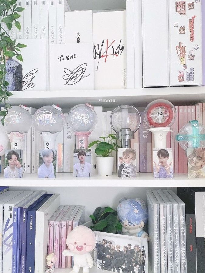 the shelves are filled with books, pictures, and other personalized items on them