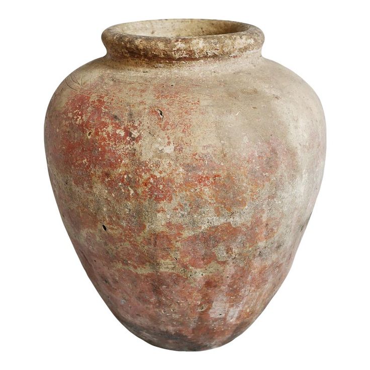 an old, dirty vase is shown against a white background