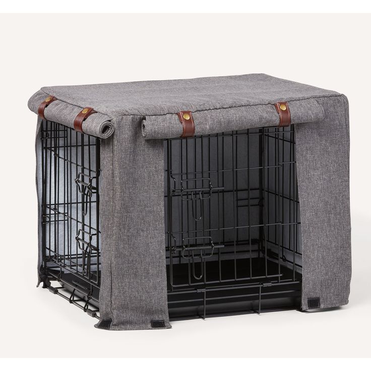 a dog crate with a cover over it