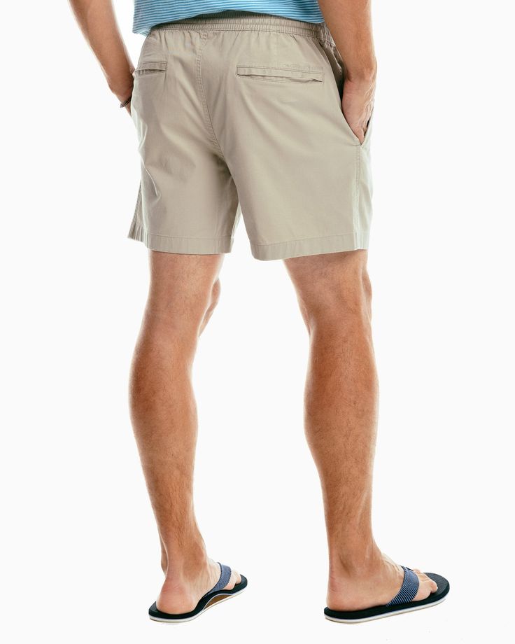 Our new Sun Farer shorts were made for versatility and comfort thanks to the elastic waistband and soft cotton fabric. You’ll want to grab a pair in every color. Style: 8640 6-inch inseam 97% Cotton 3% Stretch Model is 6'2 with a 32" waist wearing a M Fully elasticated waistband with exterior drawcord Heat seal main label Front hand pockets Back welt pockets Southern Tide embroidery on back pocket Soft to touch Machine wash cold with like colors. Do not use softener. Do not bleach. Tumble dry lo Relaxed Fit Bermuda Shorts With 5-inch Inseam, Comfortable Relaxed Fit Shorts For Vacation, Casual Stretch Beach Shorts, Relaxed Fit Athletic Shorts With Built-in Shorts, Casual Cotton Swim Trunks With Built-in Shorts, Casual Stretch Shorts For Beach, Relaxed Fit Bottoms With Built-in Shorts For Warm Weather, Casual Relaxed Fit Solid Athletic Shorts, Solid Bermuda Shorts For Vacation