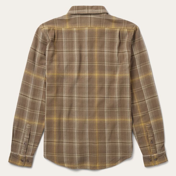 This button-front flannel shirt features an exclusive brown plaid pattern and is crafted from 100% cotton that has been yarn-dyed for rich, lasting color. It has no front yoke, a shallow straight back yoke with pleats, square pockets with flaps and button closures, two-button adjustable cuff, as well as contrast inside denim trim. Cut in our Modern Fit, for a trim, neat appearance that allows for comfort and freedom of movement. Exceedingly durable and always comfortable, our shirts are hard-wea Classic Brown Flannel Shirt With Button Closure, Classic Brown Button-up Flannel Shirt, Classic Brown Flannel Shirt, Classic Brown Long Sleeve Flannel Shirt, Classic Brown Flannel Shirt With Buttons, Brown Button-up Cotton Flannel Shirt, Classic Brown Cotton Flannel Shirt, Brown Button Closure Flannel Shirt For Work, Brown Flannel Shirt With Button Closure For Work