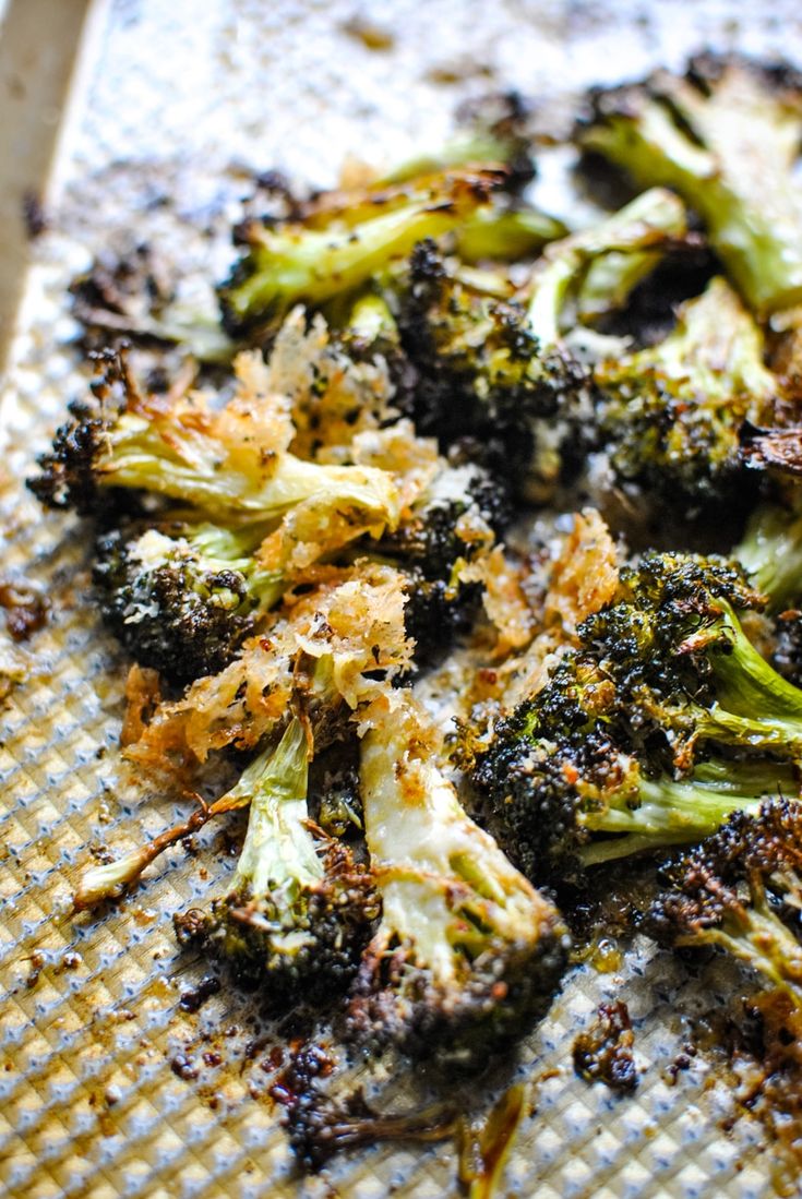 broccoli florets on a baking sheet ready to be cooked in the oven