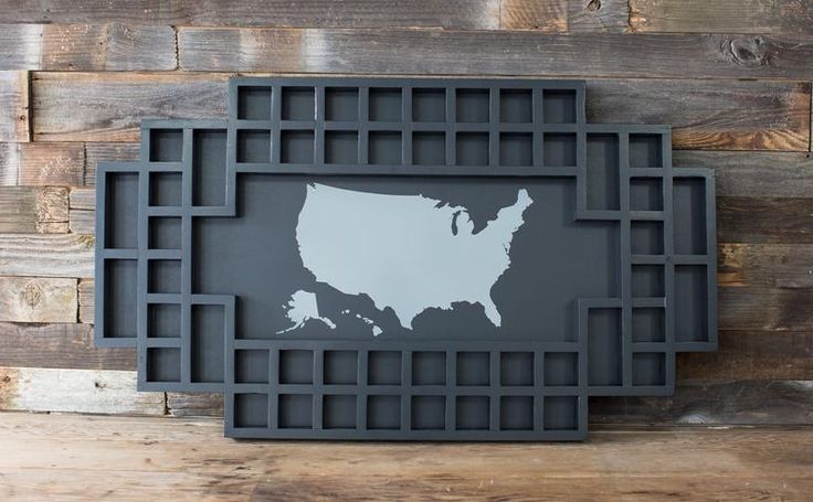 the united states is shown on a wooden wall with metal grids in front of it