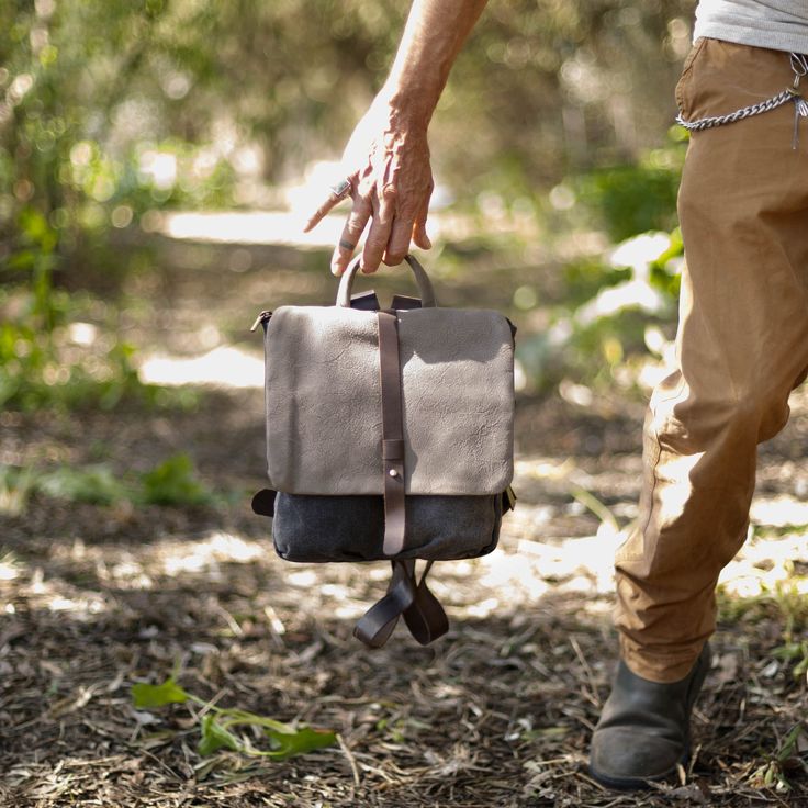 This small Backpack Women Leather is cute and stylish You Can check this different color too :https://www.etsy.com/il-en/listing/185946454/canvas-and-leather-backpack? Handmade by me from genuine Italian leather and strong denim-like cotton in charcoal. This rucksack has 5 separate compartments and is large enough to fit several notebooks, iPad and stationary, or supplies for a day trip. The front flap closes securely with two strong magnetic clasps and there is a zipped pocket in the back of th Daily Use Backpack With Leather Trim, Leather Backpack With Leather Trim For Daily Use, Leather Trim Shoulder Backpack For Daily Use, Outdoor Leather Satchel Backpack With Leather Handles, Leather Satchel Backpack With Leather Handles For Outdoor, Everyday Leather Backpack With Leather Trim, Everyday Satchel Backpack With Leather Trim, Leather Trim Satchel Backpack For Daily Use, Daily Use Rectangular Backpack With Leather Trim