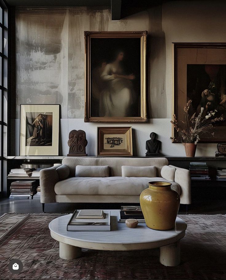 a living room filled with furniture and paintings