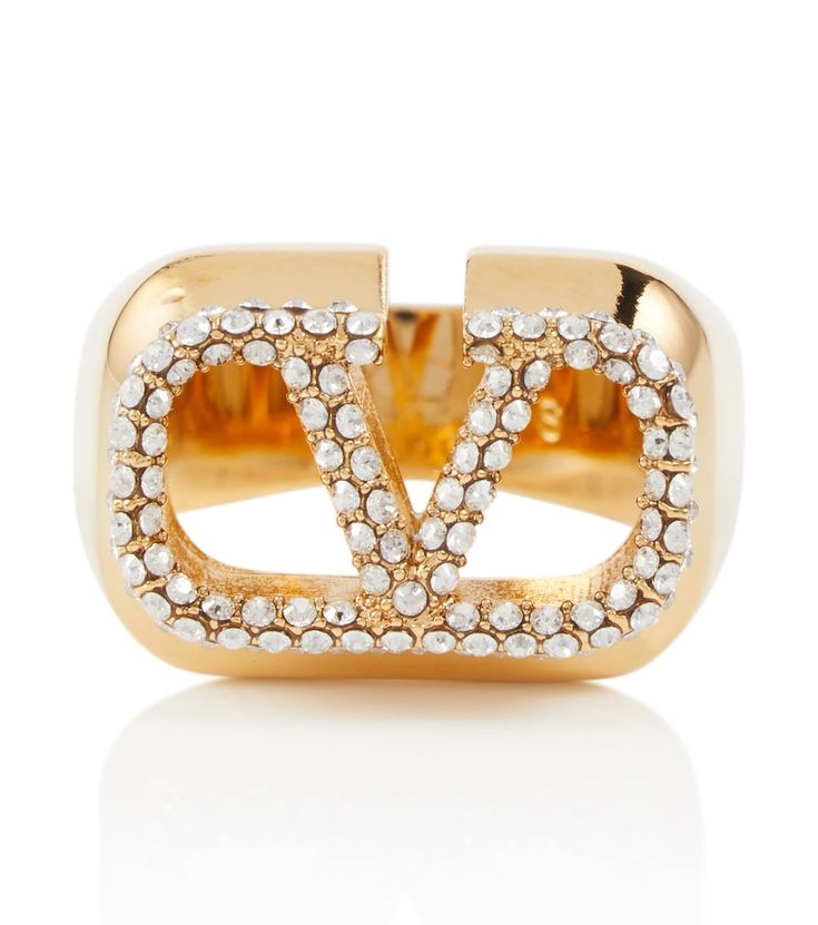 With its simple yet daring design, the VLogo ring from Valentino is a guaranteed conversation starter. It's made from gold-toned metal encrusted with Swarovski® crystals. V Logo, Luxe Life, Conversation Starters, Gold Tone Metal, Valentino Garavani, Swarovski Crystals, Gold Rings, Gold Tones, Jewelry Accessories