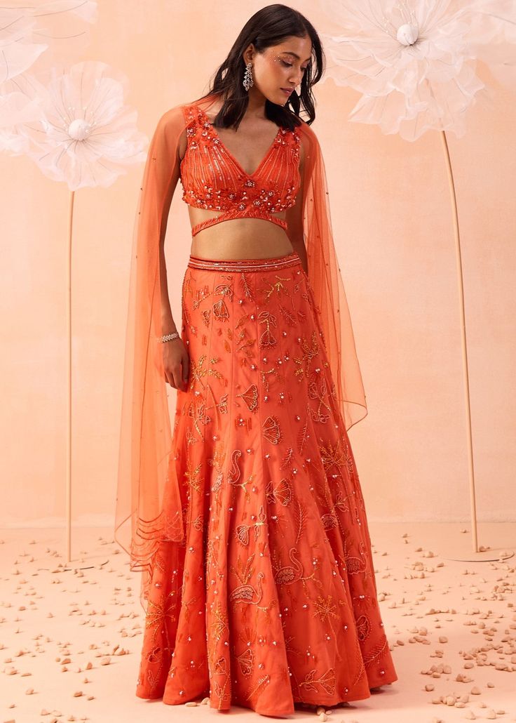 Fish cut lehenga with all over flora and fauna motifs paired with v neck embroidered blouse and dupatta. V Neck Crop Top Lehenga, Fish Cut Lehenga, Orange Lehenga, Latest Bridal Blouse Designs, Crop Top Lehenga, Sangeet Outfit, Lengha Choli, Bridal Blouse Designs, Lehenga Designs