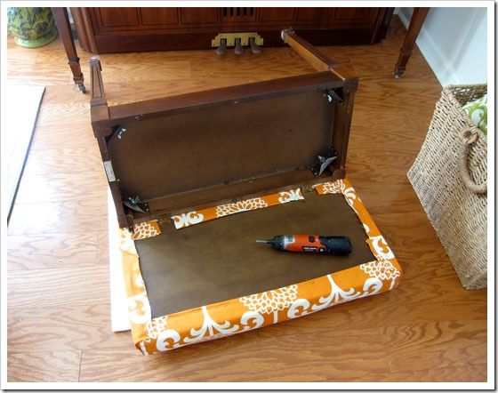 an open suitcase sitting on top of a wooden floor