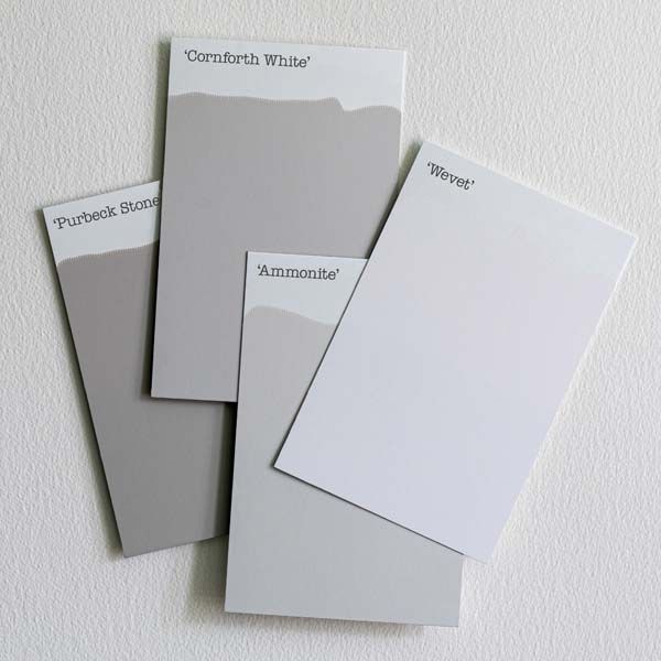 three different shades of gray paint on a white wall