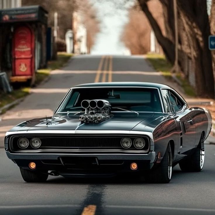 an old muscle car is parked on the street