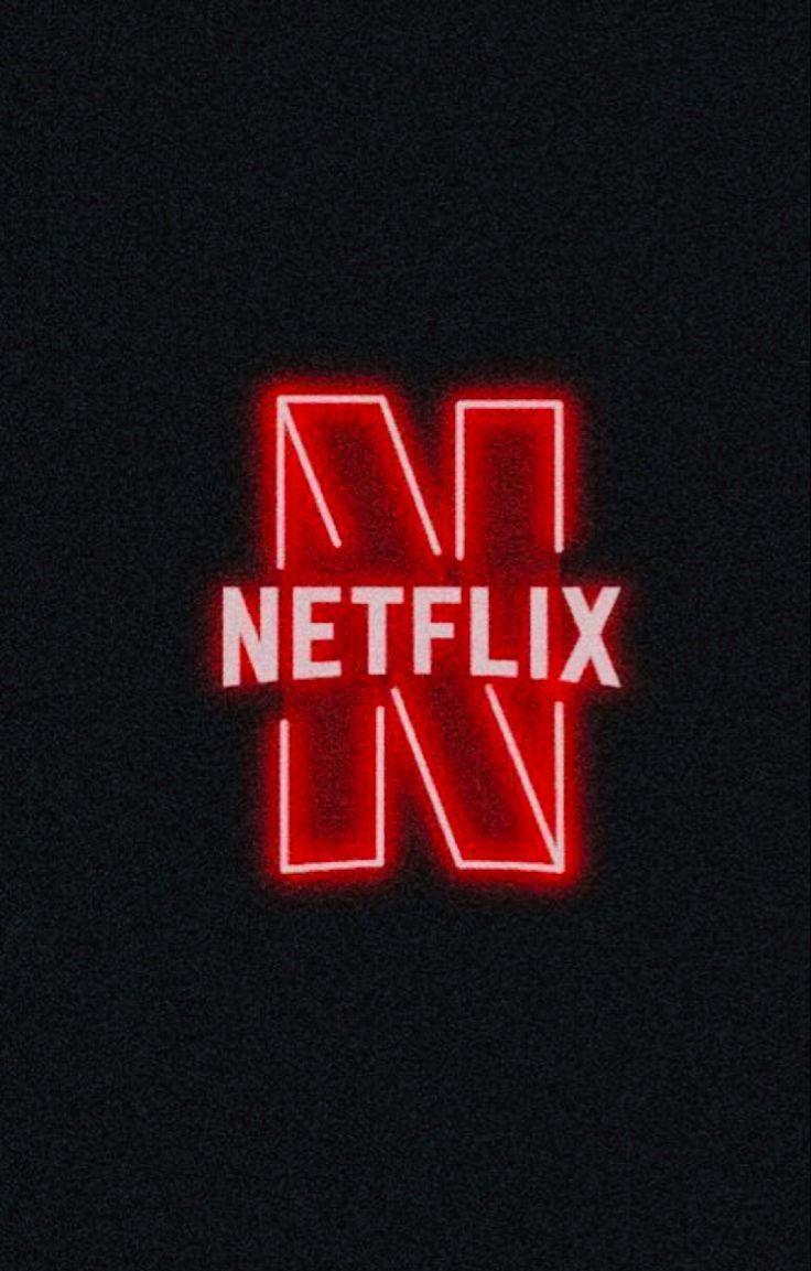 the netflix logo is lit up with red neons in the dark, and it appears to be glowing