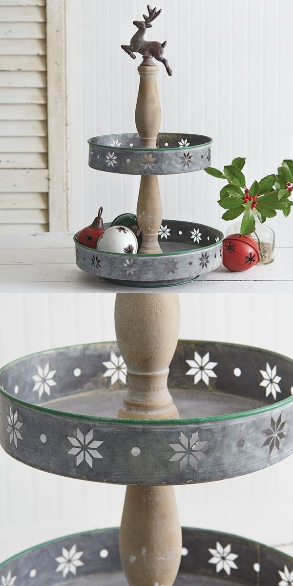 three tiered trays with christmas decorations on them