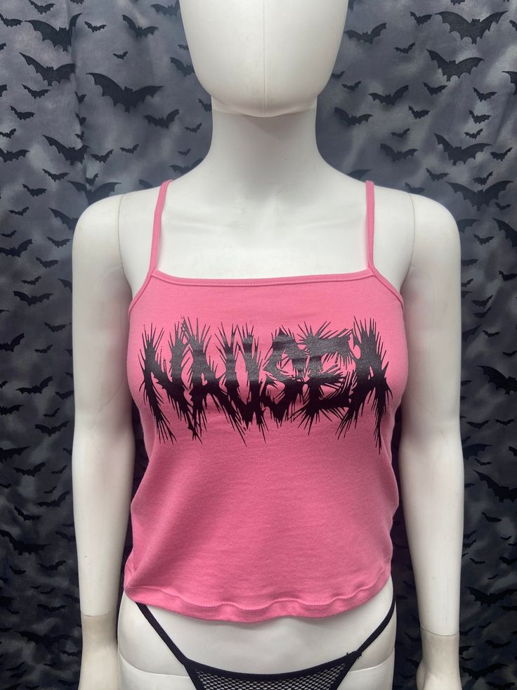 This is a pink Nausea crop tank top with spaghetti straps. This has a Nausea image screen printed on the front. 57% cotton/ 38% polyester/ 5% Spandex These are handmade screenprinted and slightly vary from the photo. Please feel free to email me any questions. Thanks for looking. I do not do exchanges and I do not take returns unless the item is damaged. I thoroughly check each item before it is shipped out. The seller is not responsible for any lost or stolen packages. Y2k Style Cotton Tank Top For Festivals, Edgy Cropped Tank Top For Spring, Y2k Pink Graphic Print Tank Top, Edgy Tank Crop Top For Spring, Pink Sleeveless Y2k Crop Top, Edgy Spring Tank Crop Top, Fitted Pink Crop Top For Streetwear, Spring Graphic Print Tank Crop Top, Trendy Graphic Print Tank Top For Music Festival